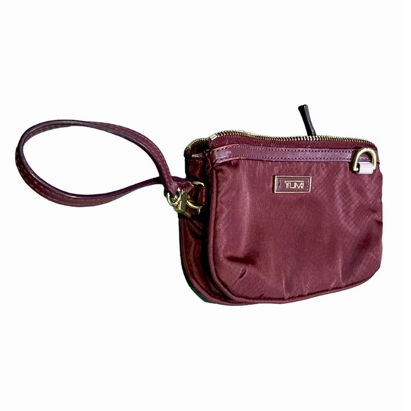 Tumi Handbags - Tumi Vienna Voyageur Wristlet Triple compartment Clutch Burgundy.